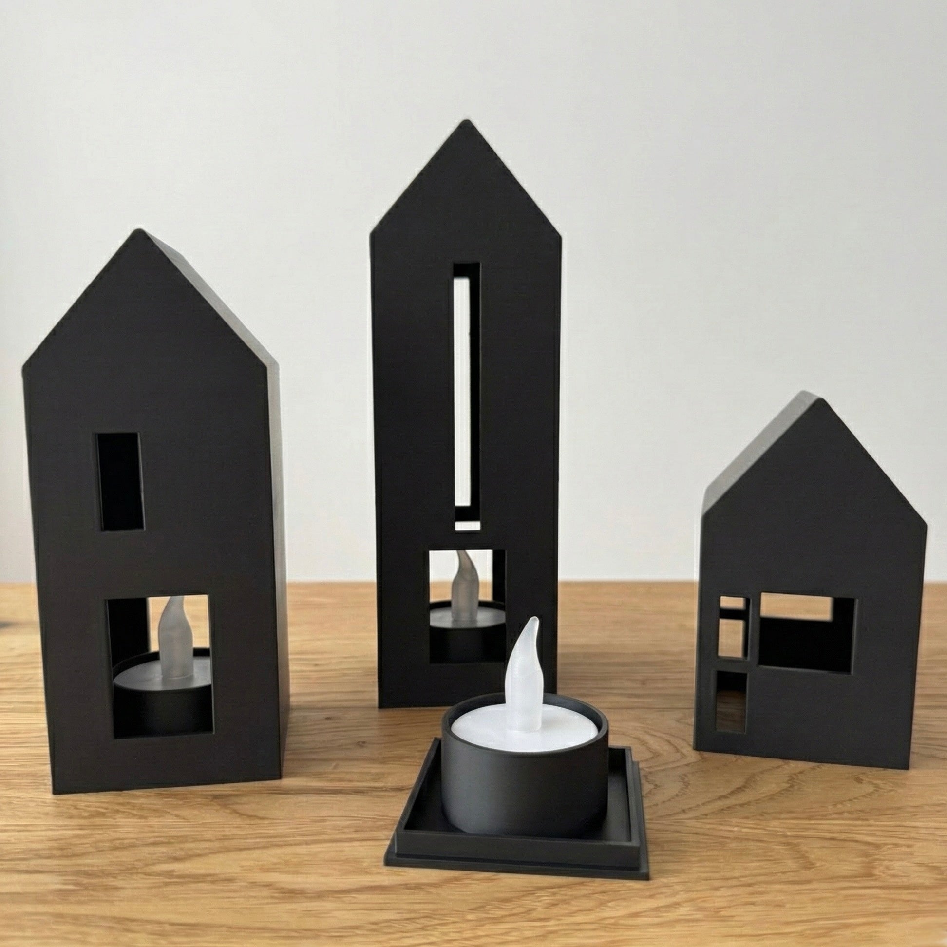 Minimalistische Teelichthäuser