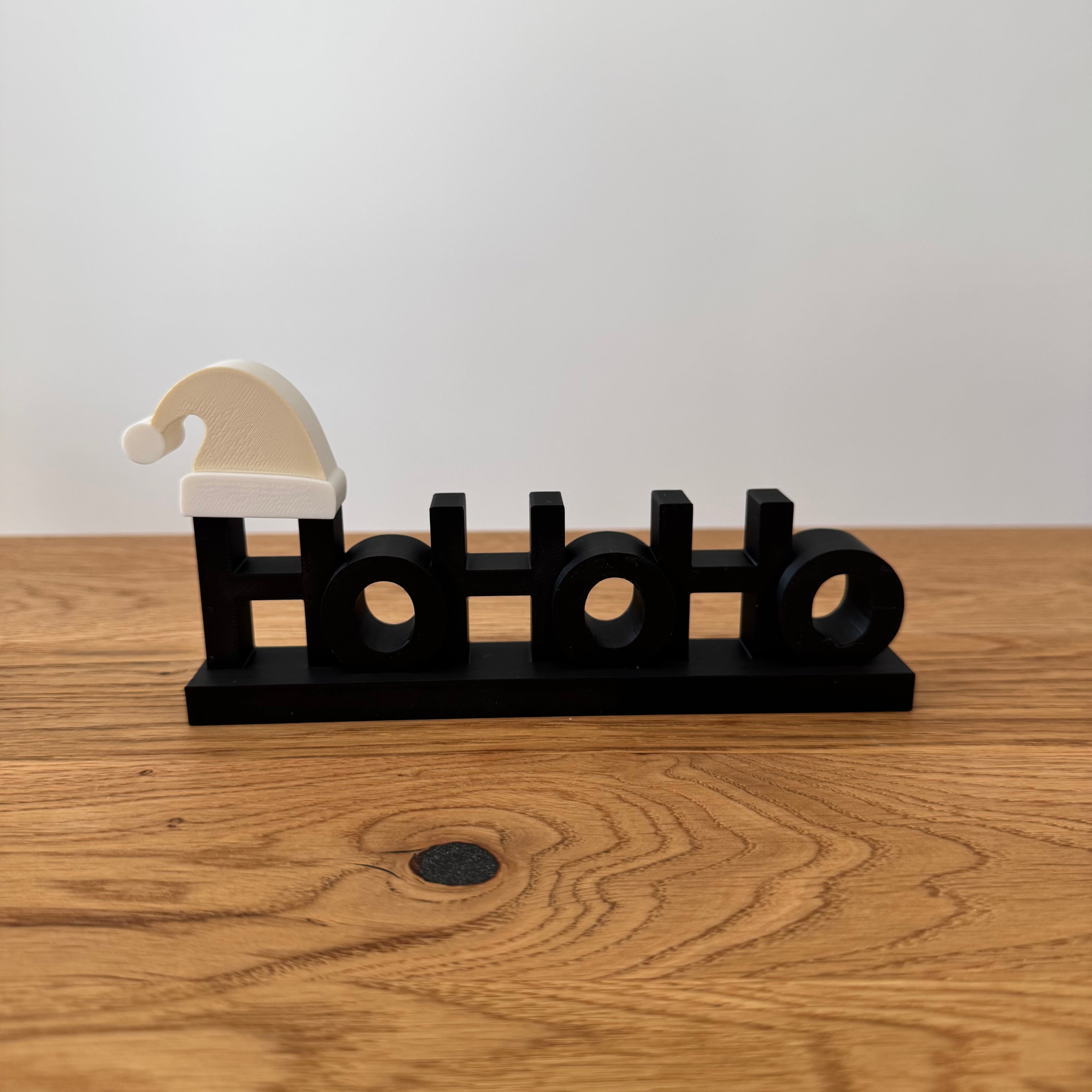 Schriftzug Ho Ho Ho mit Mütze